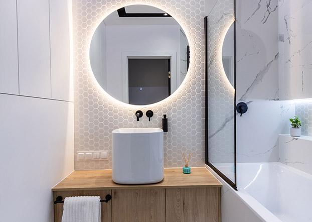 Modern fixtures and finishes upgrading a compact bathroom